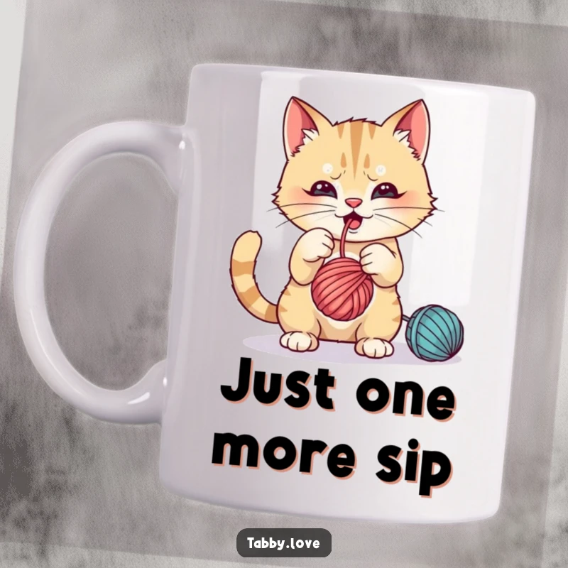 Funny Cat Mug: A mischievous cat playfully batting at a dangling ball of colorful yarn with excitement.