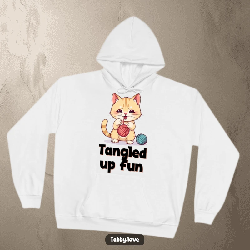 Funny Hoodie: A mischievous cat batting playfully at a dangling ball of yarn, looking delighted.