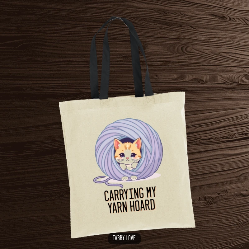 Funny cat tote bag with a curious kitten peeking from behind a colossal ball of yarn, ready for a playful escapade.